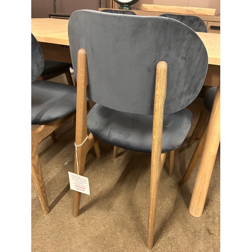 3234 - An Andersson Bianco oak extending dining table with a set of six Bari Opulence charcoal dining chair... 