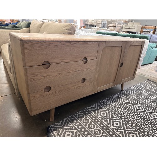 3242 - A Holcot mid century style oak 2 door, 3 drawer sideboard