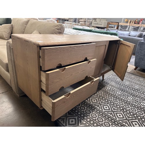 3243 - A Holcot mid century style oak 2 door, 3 drawer sideboard