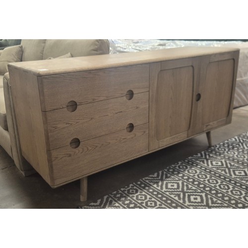 3243 - A Holcot mid century style oak 2 door, 3 drawer sideboard