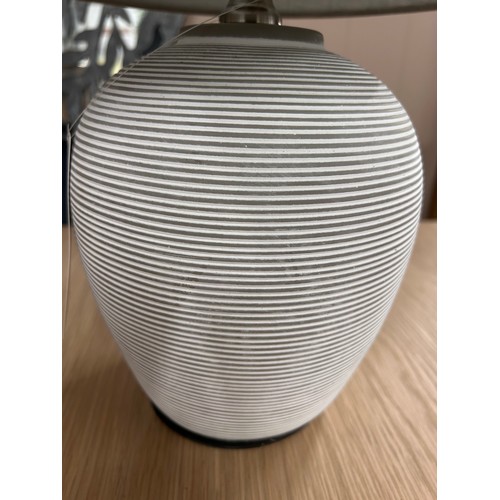 3245 - A small striped ceramic table lamp with a grey shade