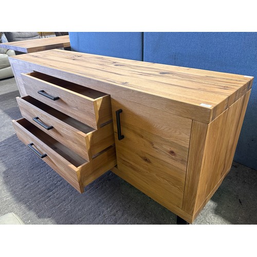 3181 - A solid oak two door three drawer sideboard