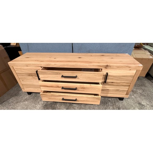 3179 - A solid oak wood two door three drawer sideboard