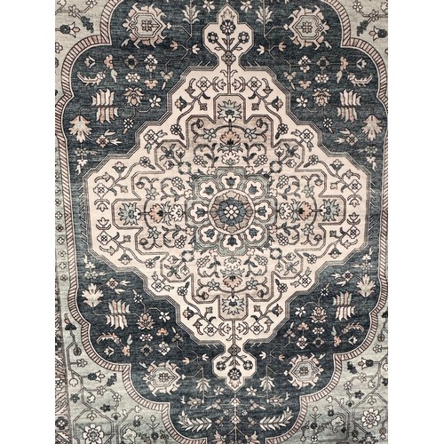 3184 - A Green and a white traditional rug (7ft x 5ft)
