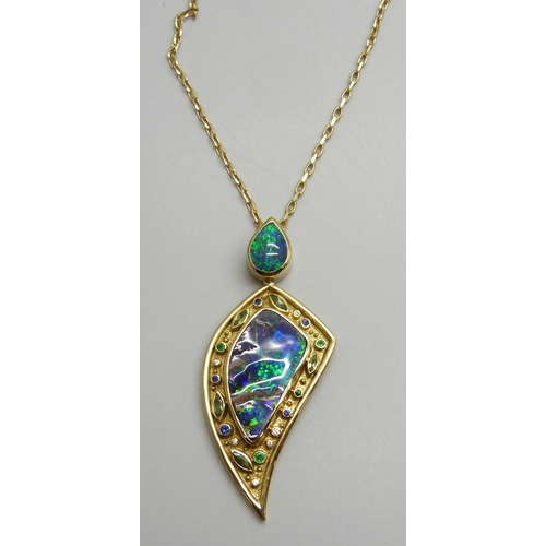 7089 - Catherine Best, an 18ct gold 14.4ct boulder opal, 2.03ct black opal, sapphire, tsavorite garnet, per...