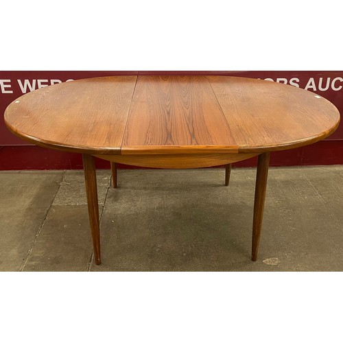 21 - A G-Plan Fresco teak circular extending dining table