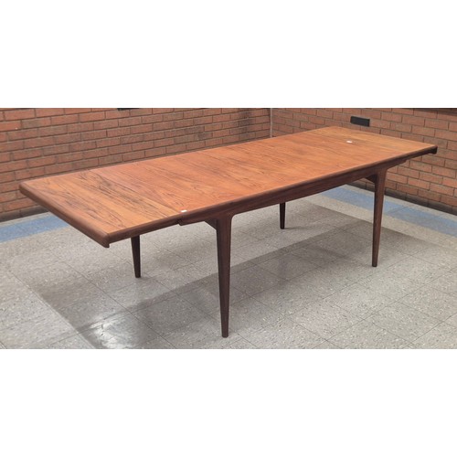 9 - A Younger Sequence teak extending rectangular dining table and four chairs, designed by John Herbert