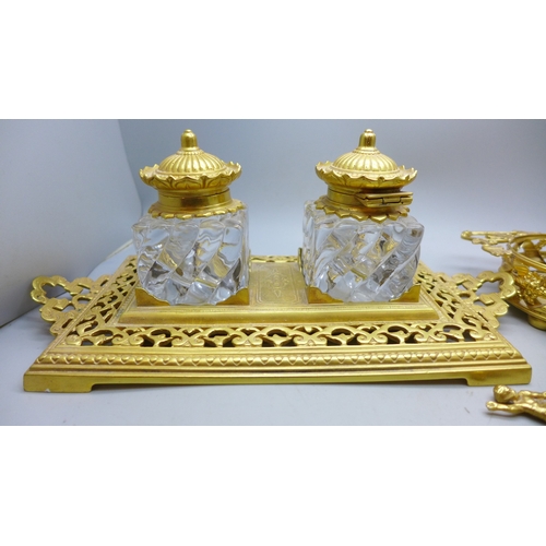 2090 - A gilt metal double ink stand with glass ink wells and a gilt metal tray with fork