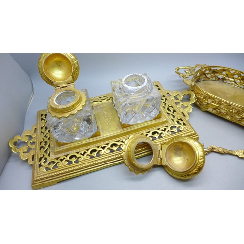 2090 - A gilt metal double ink stand with glass ink wells and a gilt metal tray with fork