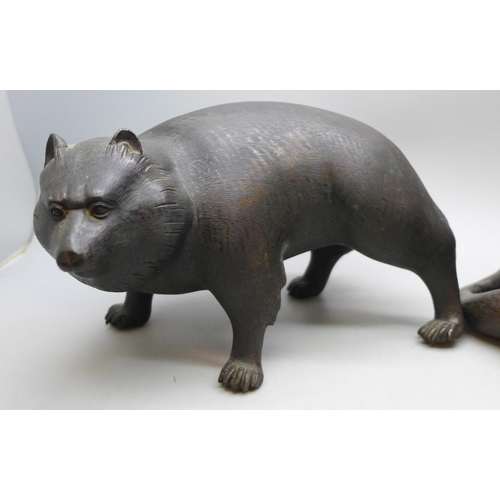 2093 - Two c1900 Japanese bronze figures, a seated fox and a Japanese raccoon dog, signed, fox 14.5cm
