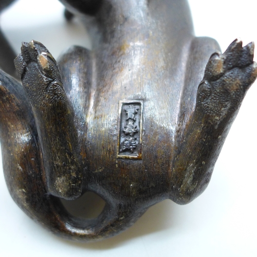 2093 - Two c1900 Japanese bronze figures, a seated fox and a Japanese raccoon dog, signed, fox 14.5cm