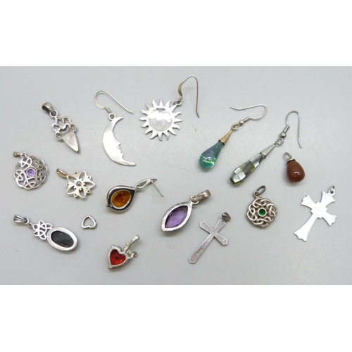 7242 - A collection of silver and white metal pendants and single earrings, some plated