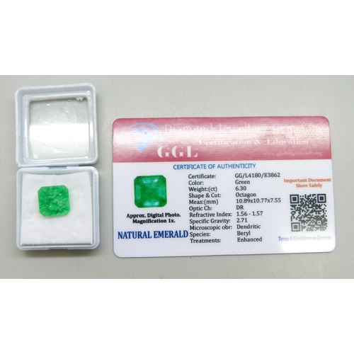 7245 - An unmounted 6.3ct emerald, with certificate