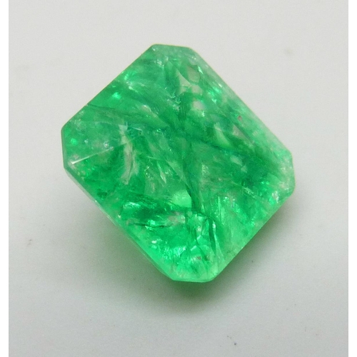 7245 - An unmounted 6.3ct emerald, with certificate