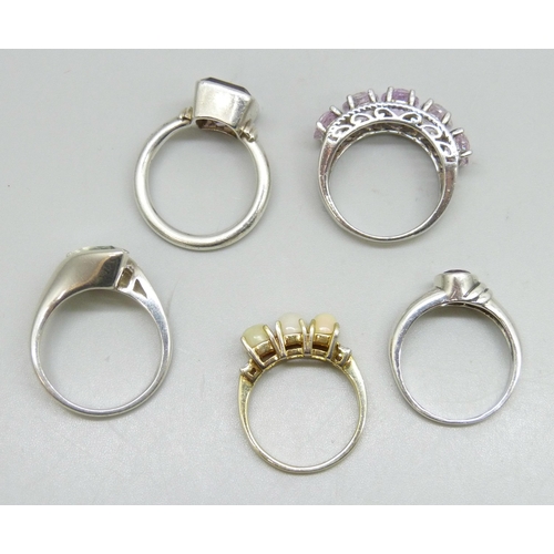 7248 - Five silver rings including opal and amethyst, 21g