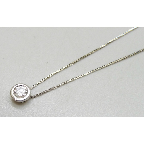7256 - An 18ct white gold diamond solitaire pendant on an 18ct gold chain, 1.9g total, diamond approximatel... 