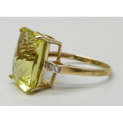 7261 - A 9ct gold, faceted green stone and diamond ring, possibly peridot, 3.5g, N