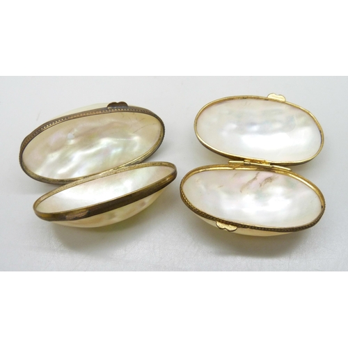 7271 - Two 19th Century gilt metal and mother of pearl thimble holders, 4.8cm largest, one with hole