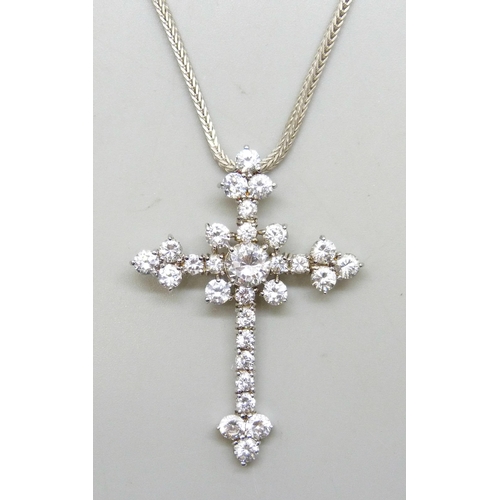 7274 - A large sterling silver crucifix and a silver chain, set with white stones, 5cm, 13g