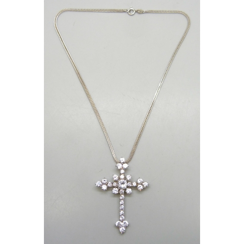 7274 - A large sterling silver crucifix and a silver chain, set with white stones, 5cm, 13g