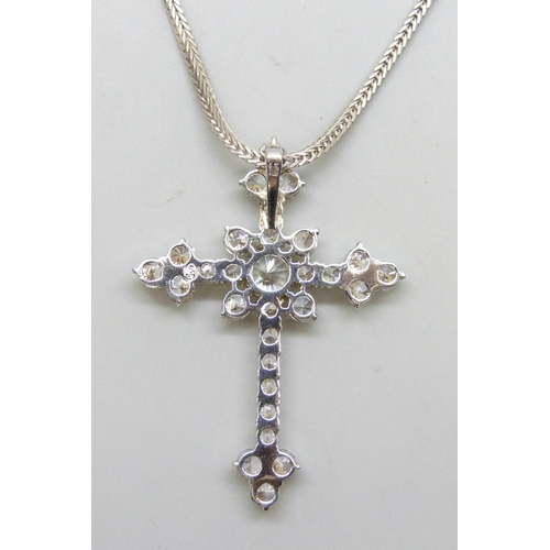 7274 - A large sterling silver crucifix and a silver chain, set with white stones, 5cm, 13g