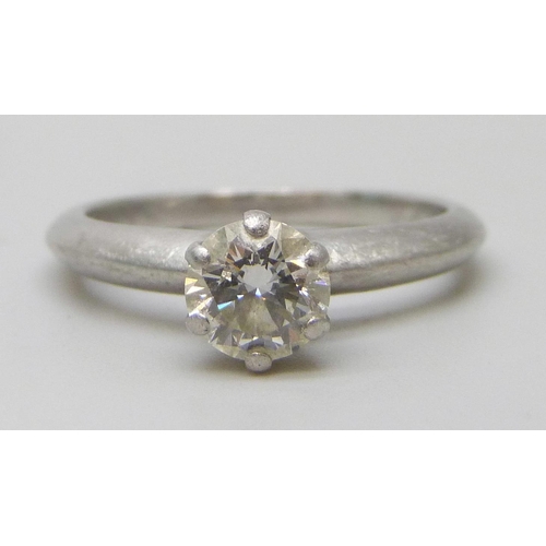 7279 - A Tiffany & Co. platinum solitaire ring set with a round brilliant cut 0.82ct diamond, colour grade ... 