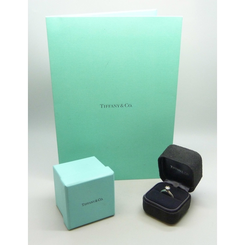 7279 - A Tiffany & Co. platinum solitaire ring set with a round brilliant cut 0.82ct diamond, colour grade ... 