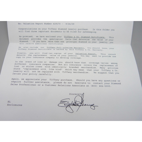 7279 - A Tiffany & Co. platinum solitaire ring set with a round brilliant cut 0.82ct diamond, colour grade ... 