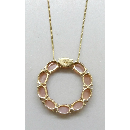 7281A - A Mitiyagoda peach moonstone Circle of Life sterling silver pendant on a silver gilt chain, 2.8cm pe... 