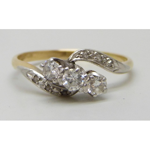 7292 - An 18ct gold and platinum nine stone diamond crossover ring, 2.9g, Q