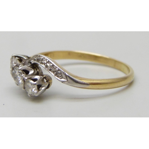 7292 - An 18ct gold and platinum nine stone diamond crossover ring, 2.9g, Q