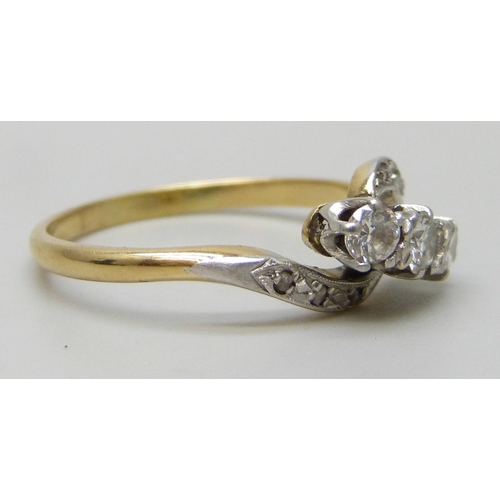 7292 - An 18ct gold and platinum nine stone diamond crossover ring, 2.9g, Q