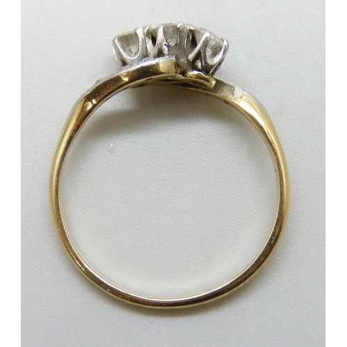 7292 - An 18ct gold and platinum nine stone diamond crossover ring, 2.9g, Q