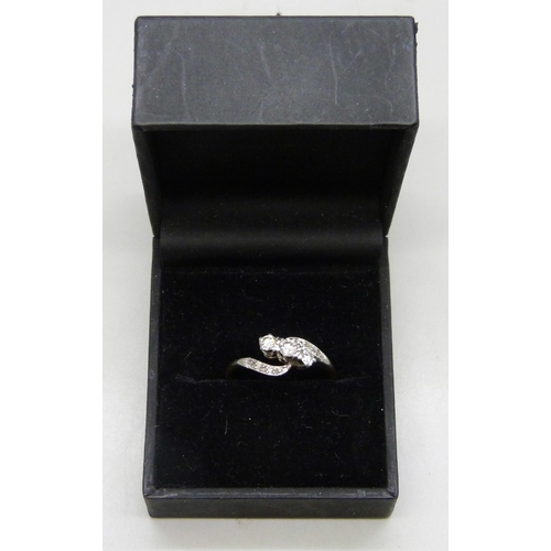 7292 - An 18ct gold and platinum nine stone diamond crossover ring, 2.9g, Q