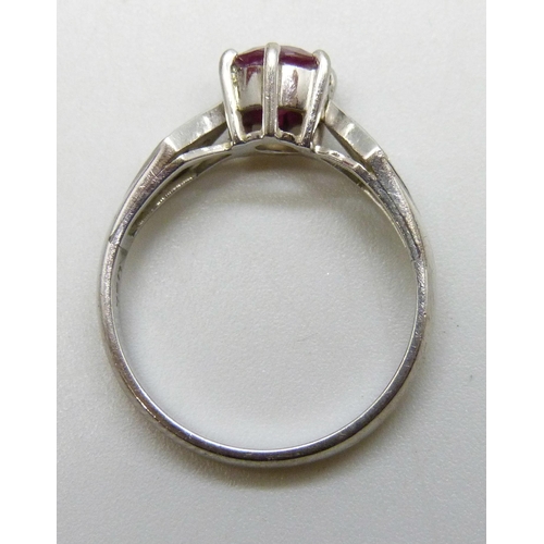 7293 - A white metal and ruby ring set with diamond shoulders, marked 750, 3.4g, N