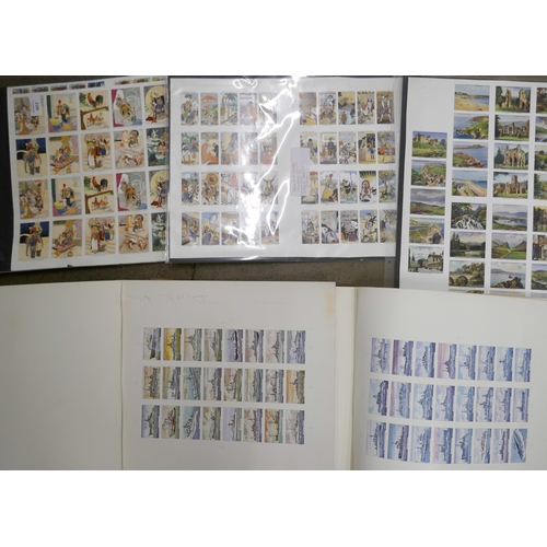 2199 - A collection of uncut cigarette card proof sheets, including Churchman Eastern Proverbs, an album of... 
