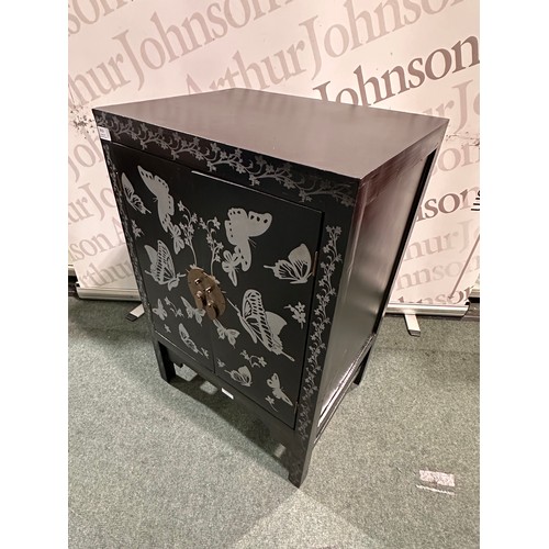 3010 - A black and grey butterfly patterned two door cabinet
