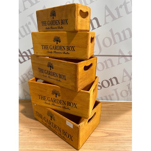 3014 - A set of five 'The garden' storage boxes
