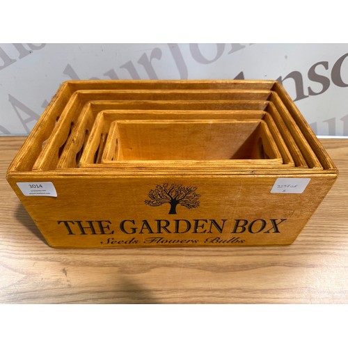 3014 - A set of five 'The garden' storage boxes