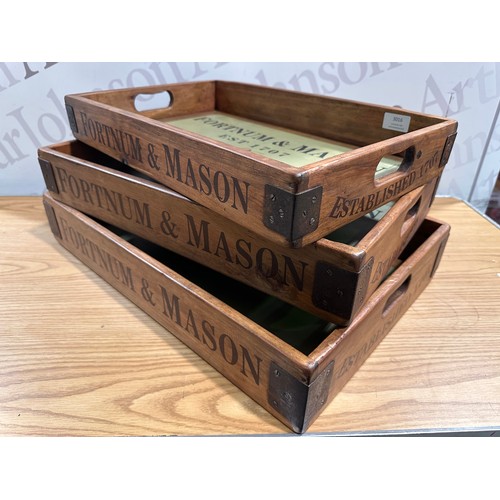 3016 - A set of three Fortnum and Mason champagne trays