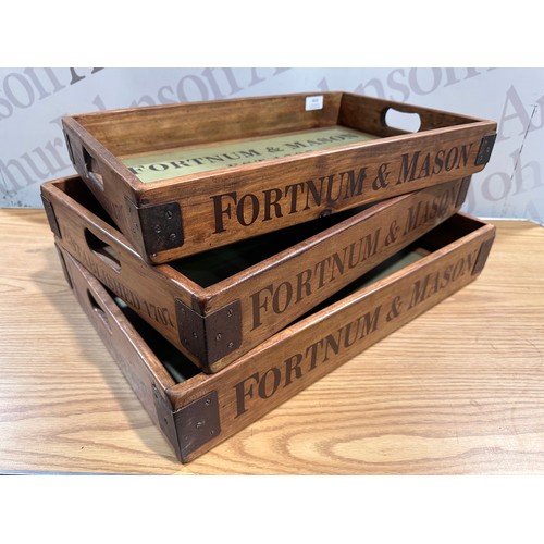 3016 - A set of three Fortnum and Mason champagne trays