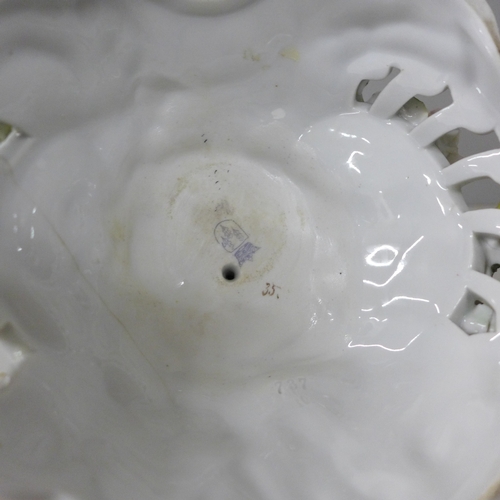 2014 - An early 20th century Schierholz porcelain figural candlestick, 28cm, a/f