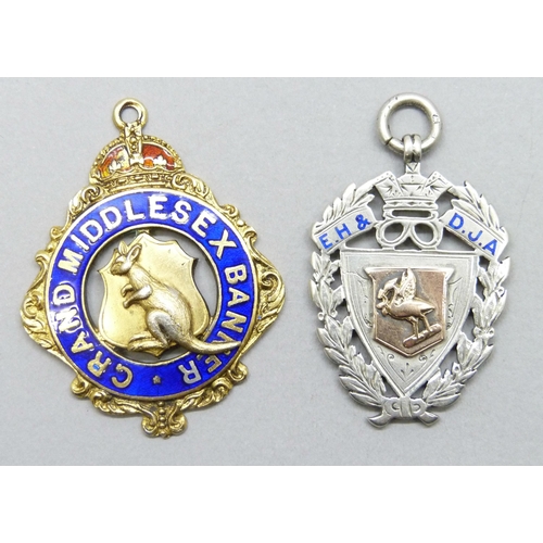 7191 - Two silver fobs including a football example, 1904, the other 1963, 36g total