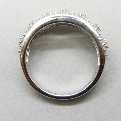 7201 - A silver ring set with approximately 0.5ct of diamonds, N/O