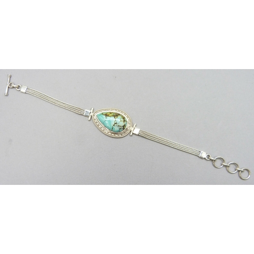 7229 - A 17.00ct Tibetan turquoise pear cut 25 x 15mm stone silver bracelet, 18g, 20.3cm