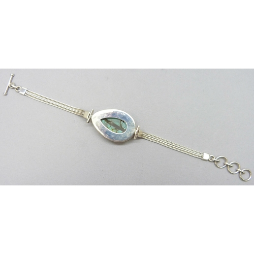7229 - A 17.00ct Tibetan turquoise pear cut 25 x 15mm stone silver bracelet, 18g, 20.3cm