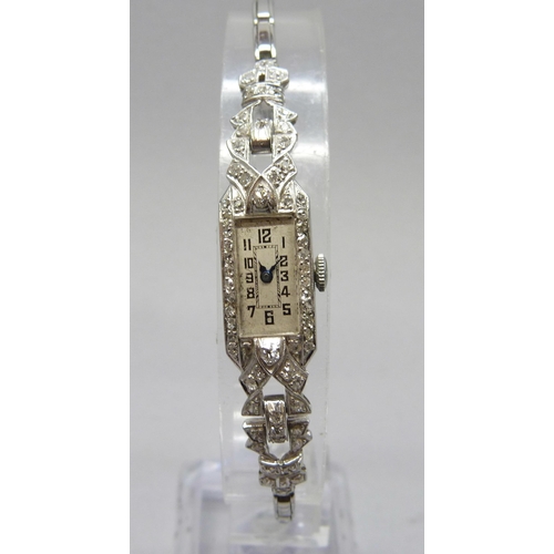 7309 - A lady's Art Deco platinum cocktail wristwatch set with diamonds, 19.5g total including movement, 13... 