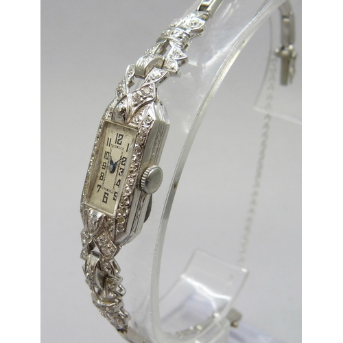 7309 - A lady's Art Deco platinum cocktail wristwatch set with diamonds, 19.5g total including movement, 13... 
