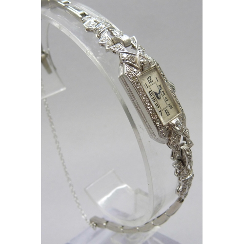 7309 - A lady's Art Deco platinum cocktail wristwatch set with diamonds, 19.5g total including movement, 13... 
