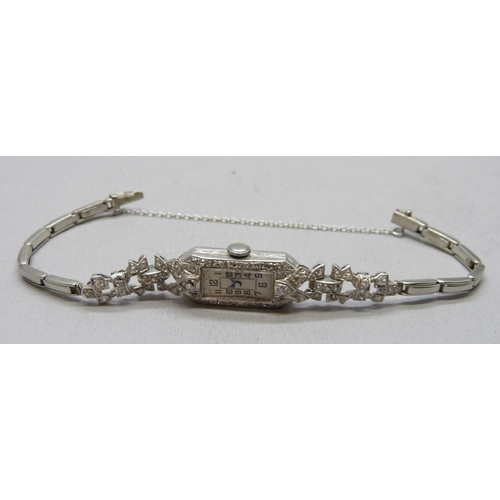 7309 - A lady's Art Deco platinum cocktail wristwatch set with diamonds, 19.5g total including movement, 13... 